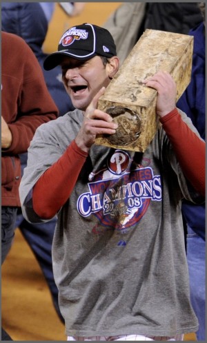 Phillies pitcher Moyer runs around with the pitching rubber after defeating Tampa Bay to win Major League Baseball's World Series in Philadelphia